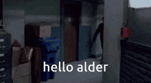 a man walking down a hallway with the words " hello alder " on the bottom