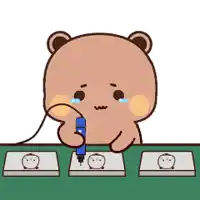 a cartoon teddy bear is sitting at a table holding a pen .