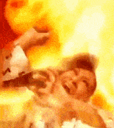 a close up of a person 's face with flames coming out of it