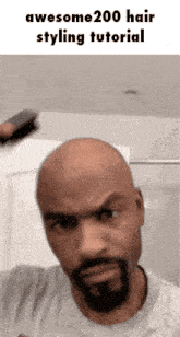 a bald man with a beard is brushing his hair with a brush and says awesome200 hair styling tutorial