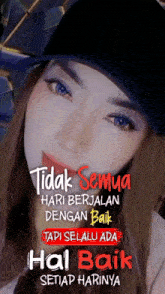 a woman wearing a black hat with the words tidak semua hari berjalan dengan baik on it