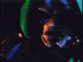 a man in a fantastic four costume and a woman in a green cape are standing next to each other
