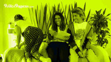 a group of people are sitting on a bed with the website piatica polinesia.com