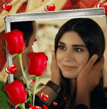 a woman in a picture frame with red roses and hearts around her