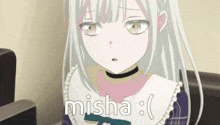 a girl with white hair is sitting in a chair with the word misha written on the bottom