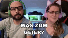 a man and a woman wearing headphones with the words was zum geier written on the screen