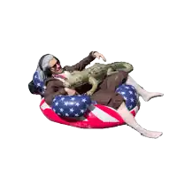 a man is laying on an american flag float
