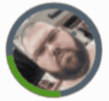 a man with a beard is sleeping in a circle with a green border .