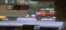 a red truck with the word bonn on the side of it