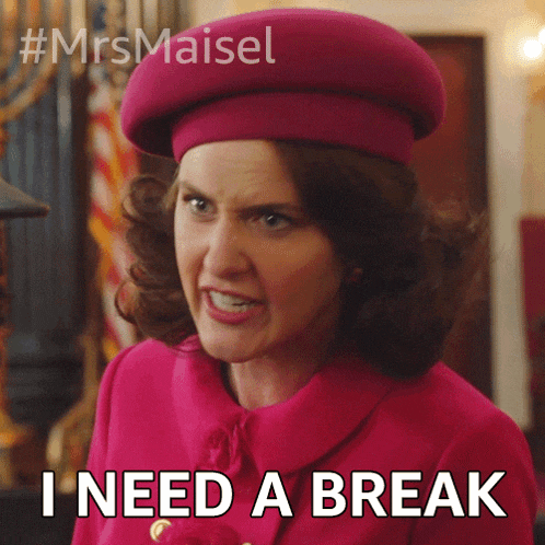 a woman wearing a pink hat and a pink coat says i need a break