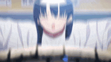 a blurry picture of a girl with a light shining on her face