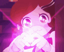a girl making a heart shape with her hands