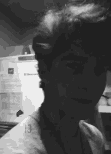 a black and white photo of a person with the number 13 on the back of their shirt