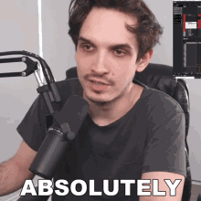a man sitting in front of a microphone with the word absolutely on the bottom right