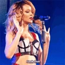 a woman singing into a microphone with the words fuck that on the bottom