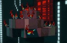 a bunch of colorful birds are sitting on a cube