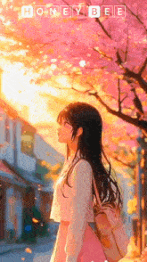 a girl is walking down a street under a cherry blossom tree