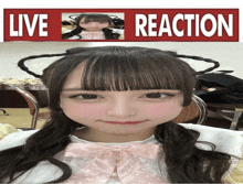 a picture of a girl with a pink bow and a sign that says live reaction