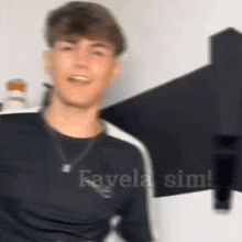 a blurry picture of a young man wearing a black shirt .