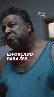 a man in a blue tank top says globo play on the bottom right