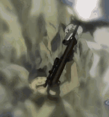a painting of a man holding a sniper rifle in the air