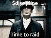 a man in a suit and hat is standing in front of a building and saying `` discipline time to raid '' .
