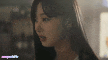 a close up of a woman 's face with the words " aespagifs " below it