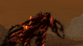 a painting of a monster with fire coming out of it 's eyes