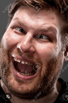 a man with a beard is making a funny face and his mouth is open