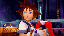 sora from kingdom hearts holding a red object