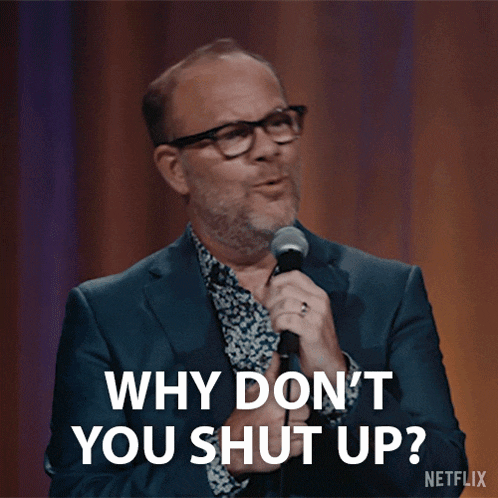a man speaking into a microphone with the words 