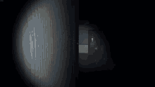 a screenshot of a video game shows a room with a trash can and a light