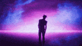 a silhouette of a man standing in front of purple lights
