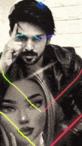 a black and white photo of a man and a woman with neon lines around them