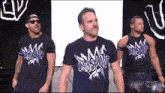 a group of men wearing shirts that say mosquito