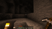 a screenshot of a minecraft game shows a creeper and a block that says stone