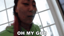 a woman with pink hair says oh my god