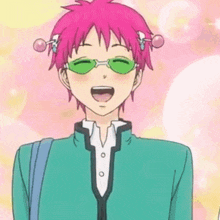a man with pink hair and green sunglasses is standing in front of a building .