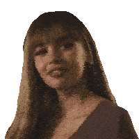 a woman with long hair and bangs wearing a purple shirt
