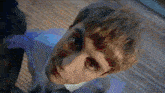 a close up of a man 's face with his eyes closed