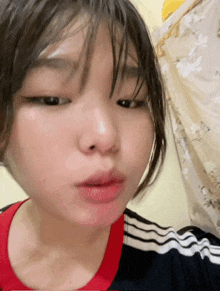 a close up of a girl 's face with her eyes closed and her mouth open