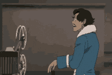 a man in a blue jacket is standing in front of a projector
