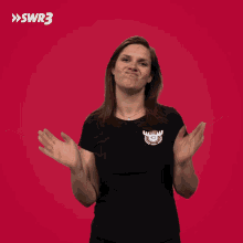 a woman wearing a black shirt with a moose on it