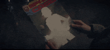 a person is holding a copy of a comic book called spy case
