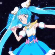 a girl in a blue dress is singing into a microphone .
