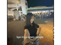 a woman is standing in front of a building with the words bye mga lonely people written on the bottom