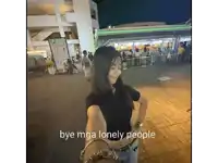 a woman is standing in front of a building with the words bye mga lonely people written on the bottom