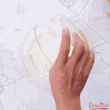 a red silicone muffin pan is on a wooden cutting board