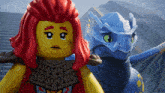 a lego girl with red hair stands next to a dragon
