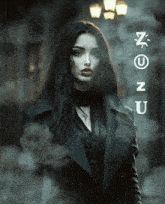 a woman in a black coat stands in front of a sign that says no